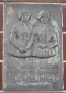 Door Maurits Witdouck ontworpen gedenkplaat voor Rosalie en Virginie Loveling. Wordt in 1978 onthuld aan hun geboortehuis aan de Langemunt te Nevele, België (1978).
